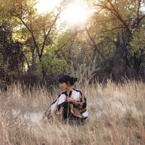 Sacred Spaces Apothecary: Lesley Gilbert sitting in a field